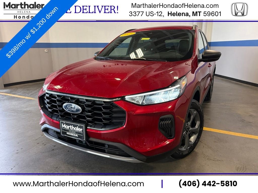 2025 Ford Escape ST-Line in Rapid Red Metallic Tinted Clearcoat — front three-quarter view