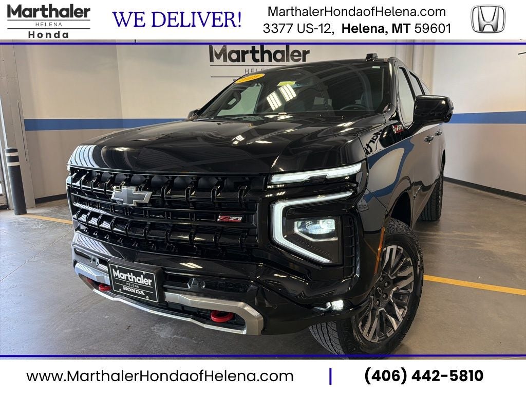2025 Chevrolet Suburban Z71 w/ Adaptive Cruise in Black — front three-quarter view