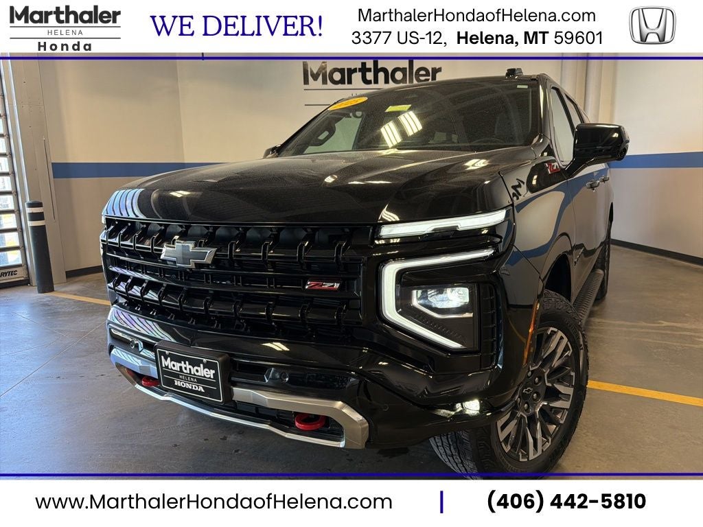 2025 Chevrolet Suburban Z71 w/ Nav & Adaptive Cruise in Black — front three-quarter view