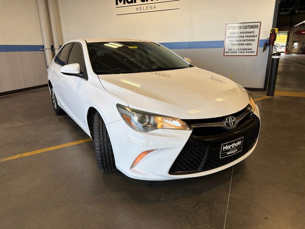 2016 Toyota Camry — rear three-quarter view