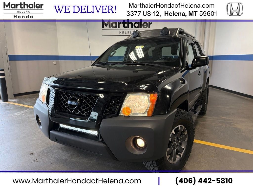 2014 Nissan Xterra PRO-4X w/ Leather & Tow Pkg in Super Black — front three-quarter view